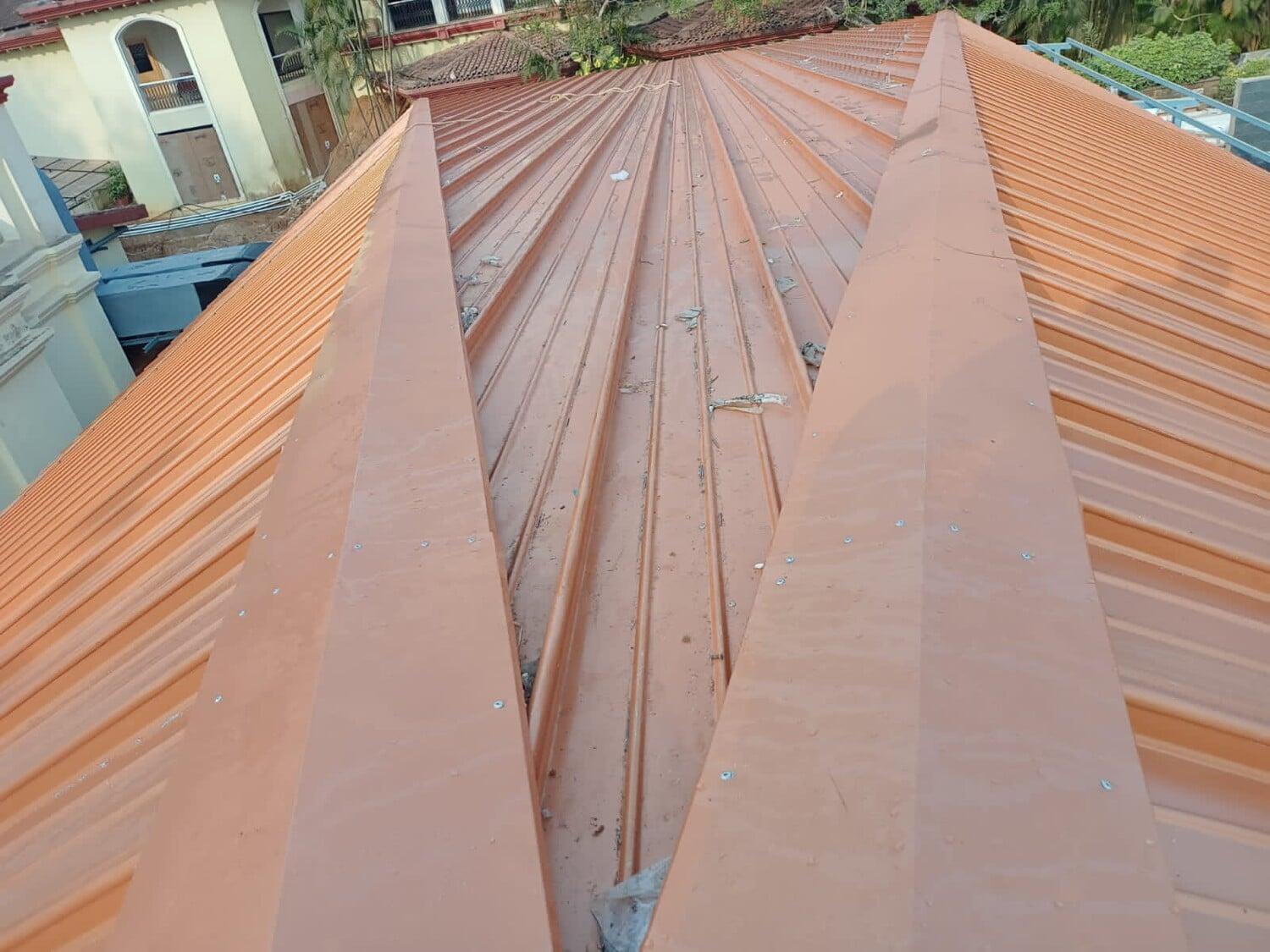 Architectural standing seam roofing for Lodha Mumbai: Premium metal building envelope featuring a minimalist aesthetic and hidden fastener technology by Rishonn & Reyansh.
